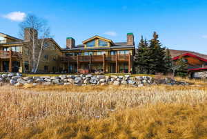 Rear view of property featuring a chimney