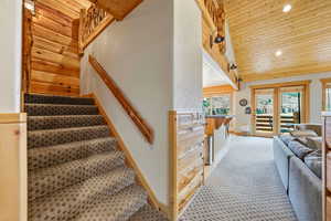 Stairway with wooden ceiling and recessed lighting
