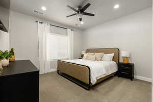 Bedroom 2 with on suite bathroom. Carpeted bedroom featuring a ceiling fan and recessed lighting