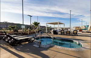 View of pool with a community hot tub
