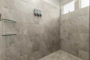 Primary bathroom with tiled shower