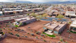 Aerial perspective of suburban area featuring a mountain backdrop
