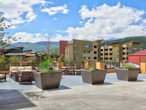 View of patio with a mountain view, outdoor lounge area, and outdoor dining area