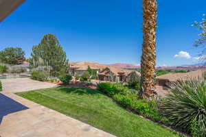 View of yard with an outdoor pool and a mountain view