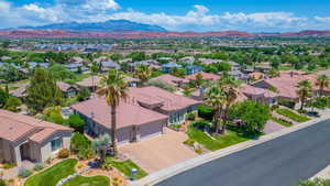 Aerial view of residential area featuring a mountain backdrop
