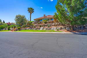 View of front of home featuring a chimney