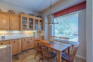 Dining space with stone tile flooring