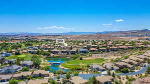 Aerial view of residential area with a water and mountain view and a golf course