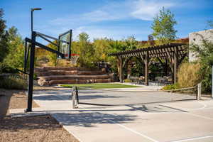 View of sport court featuring a pergola, a patio, and community basketball court