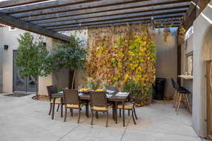 View of patio / terrace with outdoor dining area and a pergola