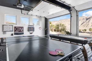 Recreation room featuring a mountain view