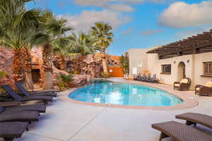 Swimming pool featuring a patio and a pergola