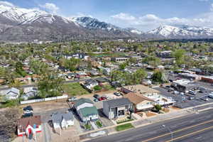Aerial perspective of suburban area with a mountainous background