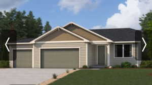 View of front of house featuring driveway, an attached garage, and a front yard