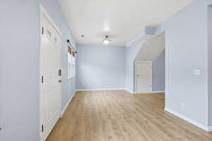 Interior space with light wood finished floors and baseboards