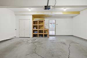 Garage featuring a garage door opener