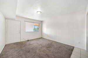 Empty room featuring baseboards