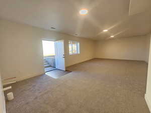 Unfurnished room featuring carpet and recessed lighting