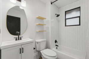 Bathroom featuring shower / bathtub combination and vanity