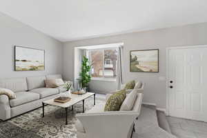 Carpeted living room with baseboards