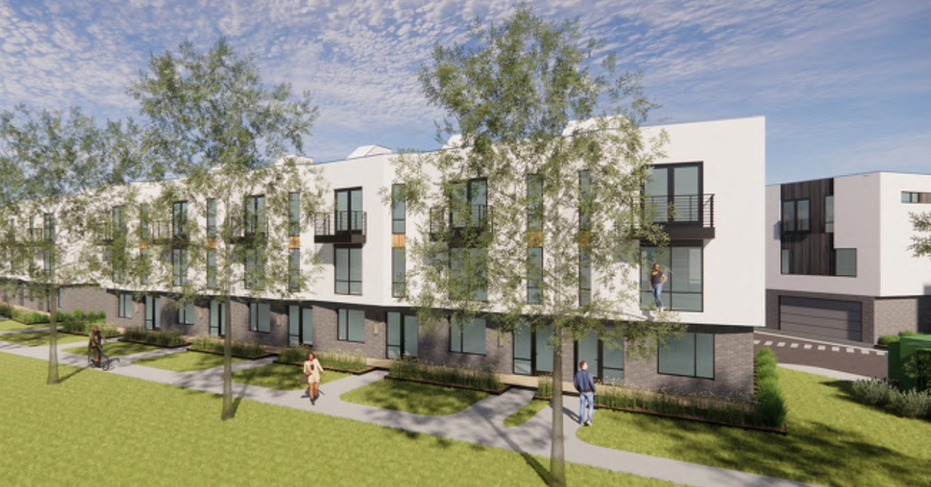 Modern townhome-style residences featuring white facade, dark brick lower levels, large windows, and private balconies with black railings