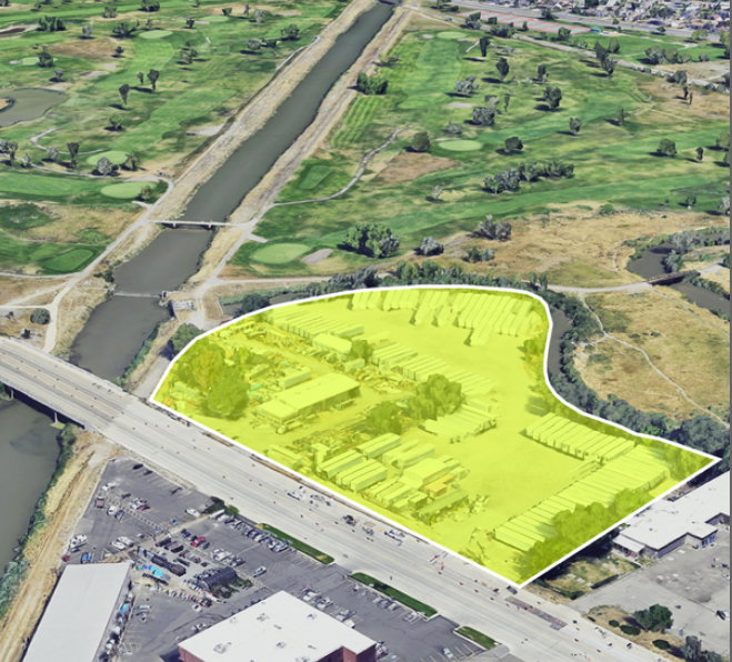 Aerial perspective highlighting a commercial property with extensive paved areas