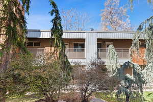 View of front of property with a balcony
