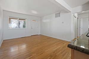 Foyer featuring light wood-style flooring