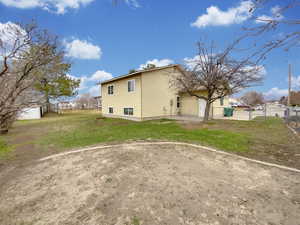 Rear view of house featuring a patio area