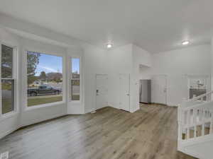Interior space featuring light wood-style flooring and baseboards