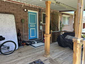Doorway to property with covered porch
