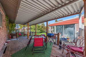 Deck with outdoor dining area and grilling area