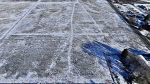 Snowy aerial view featuring a rural view