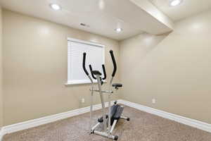 Workout room featuring carpet and recessed lighting