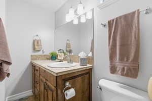 Bathroom featuring vanity and a chandelier