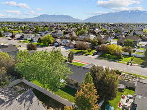 Aerial perspective of suburban area featuring a mountainous background