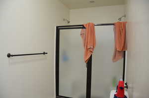 Full bathroom with a stall shower