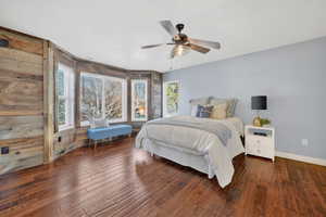 Bedroom featuring dark wood-style floors and a ceiling fan
