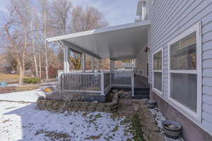View of patio featuring a wooden deck