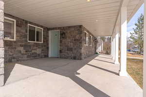 View of patio featuring an attached carport