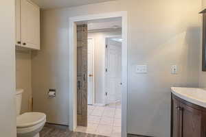 Bathroom featuring vanity and toilet