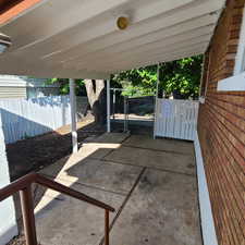 View of patio for east unit / terrace featuring a gate