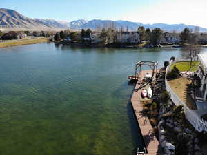 Water view with mountains and nearby suburban area