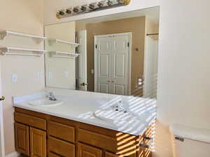 Full bath with double vanity and curtained shower