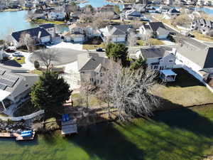 Aerial perspective of suburban area with a nearby body of water