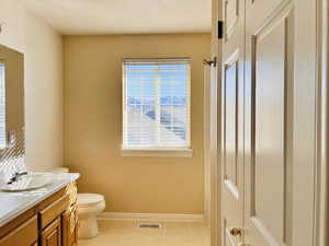 Full bathroom with vanity, a shower with shower curtain, and light floors