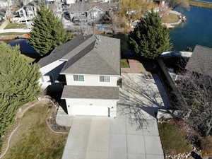 Aerial perspective of suburban area with a large body of water
