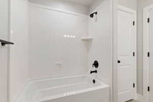 Bathroom featuring shower / bathtub combination