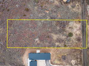 Aerial view of property and surrounding area with property parcel outlined