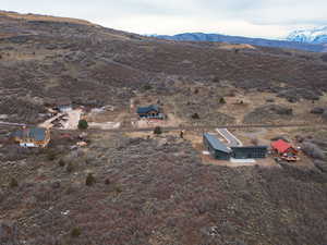 View of subject property featuring a mountainous background